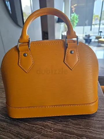 Small mustard structured leather handbag with top handles