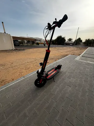 Adult Electric Scooter with Rear and Front Suspension - Good Condition - Comes with Charger and Seat