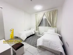 For monthly rent in Ajman, two-bedroom apartment with a balcony open view, fully furnished with eleg