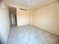 Two bedrooms and a living room, first occupancy, for annual rent in Al Alia, Ajman, near Nesto. A gr