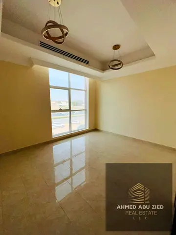 2BR hall in Al Rawda 2 opposite Kanz Mall, prime location, large space, central AC, balcony, 2 bath
