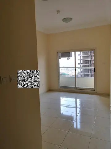 Excellent 1-bedroom apartment for sale in Emirates City, 956 sq.ft, 7th floor, direct view of Sheikh Khalifa Street, currently rented for AED 26,000 a
