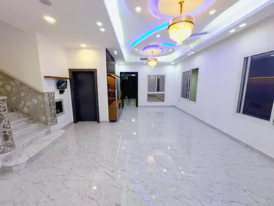 Villa for rent in Al Yasmin | 5 master bedrooms + maid's room | Roof | Parking for 6 cars | 125,000 AED in 4 installments
