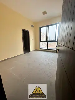Brand New 1st Tenant Large 2BR Apartment (2 Masters) with Balcony & Central AC for Rent in Al Jurf 3