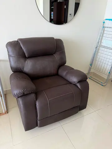 Single brown reclining armchair in good condition