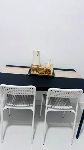 Brand new Compact black dining table with two white chairs - good condition