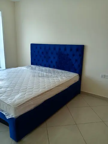 Blue upholstered double bed with storage, good condition