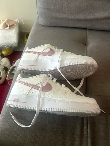 White Nike Air Force 1 with pink swoosh, lightly used, size unknown