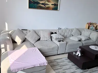 Light grey L-shaped sectional sofa with chaise, good condition