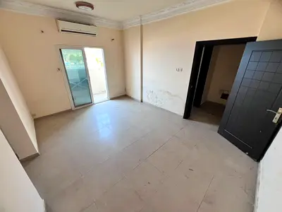 Balcony with an open view - 2 kitchens - Separate living room - Split AC - Prime location near all services on Al Mina Street