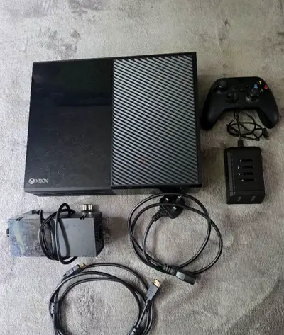 X box one console with games very light usage,very gud condition, sparingly used
