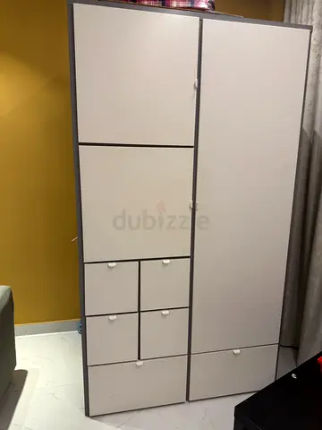 Tall white Ikea storage cabinet with multiple doors and drawers - perfect condition