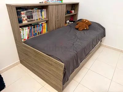 Single bed with built-in bookshelf headboard and trundle storage -  oak finish