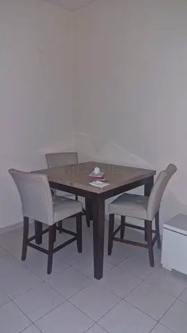 Wooden dining table with 4 upholstered chairs - good condition