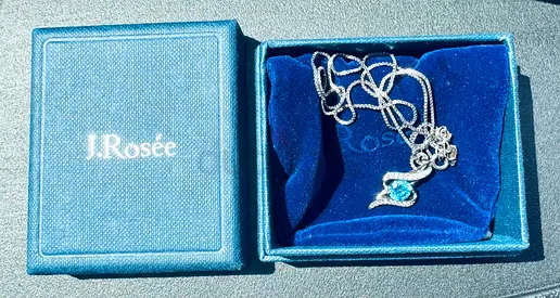 Silver necklace with blue gemstone pendant (J.Rosée)