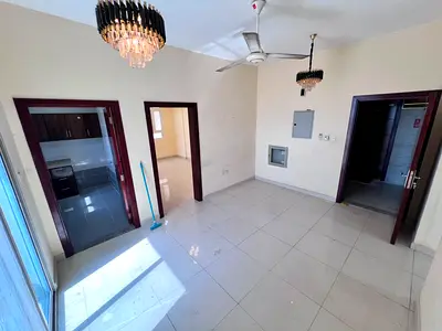 Two bedrooms and a living room in Al-Aliya, behind Al-Bayt Al-Mutawhid, near Mohammed Bin Zayed Exit. Two bathrooms with a balcony. Split AC units.