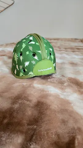 Baby soft protective helmet (green dinosaur print) - gently used