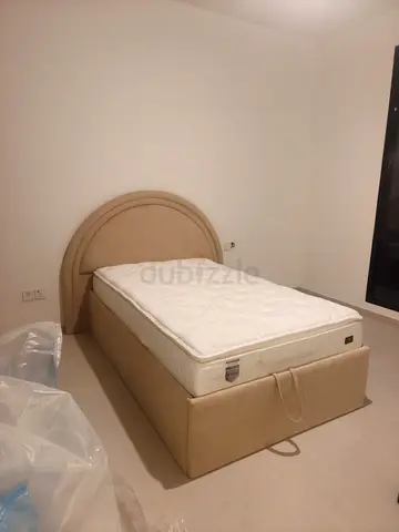 Single beige upholstered bed with storage - good condition