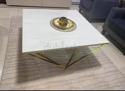 Square marble-top coffee table with gold metal base