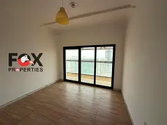Luxurious 3-bedroom apartment with a living room for annual rent in Al Sa'a Tower in Al Rashidiya 1.