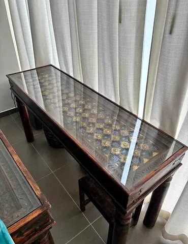 Marina Long carved wooden console table with glass top
