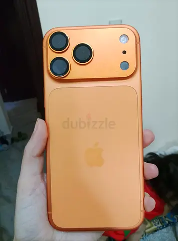 Used iPhone with orange protective case - good condition
