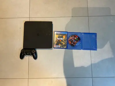PS4 Slim 500GB + Controller + 2 Games – Tested & Working (HDMI and power cable not included)
