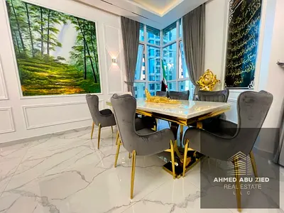 Luxurious 3-bedroom apartment with hotel-style furnishings in Al Khor Towers, Ajman. Includes a maid's room, 3 bathrooms, and 2 balconies with sea vie