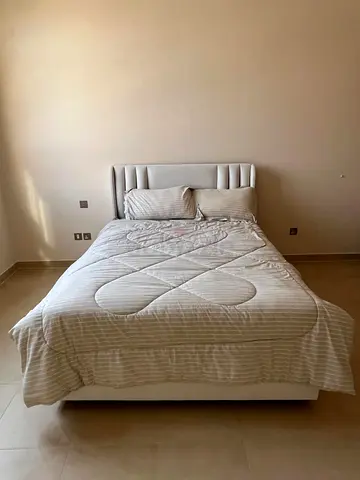 Queen upholstered bed - light grey, good condition