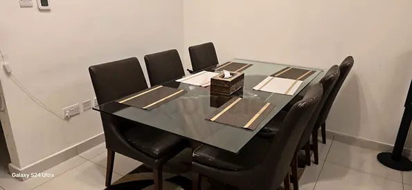 Glass top dining table with 6 upholstered chairs - good condition