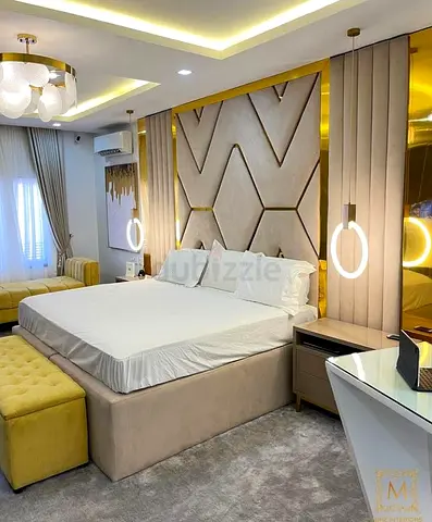 Modern upholstered king bed with padded headboard and nightstands