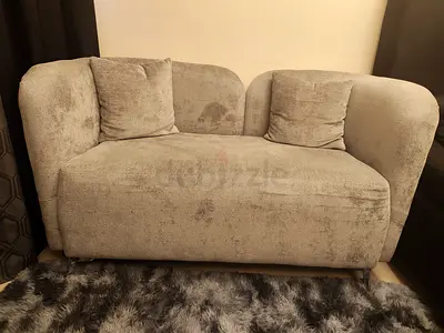 Grey two-seater sofa in almost brand new condition