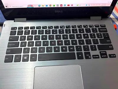 Dell laptop (silver) in good working condition. Dell Intell Core i 7 -Generation 7. 11 windows