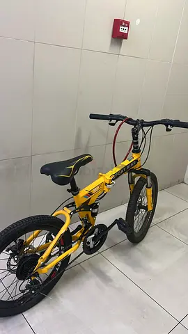 Yellow foldable mountain bike with gears