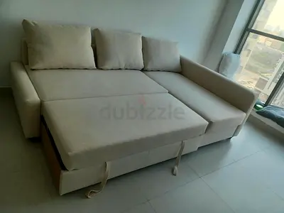 Comfortable Cream L-Shaped Sofa Bed with Pull-Out Extension