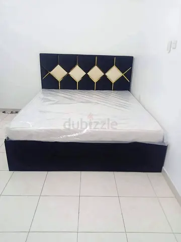 King size upholstered bed with storage and mattress