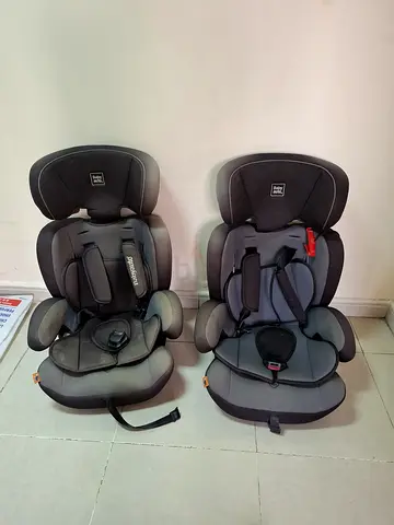 Pair of Britax-style child car seats / boosters in grey — good used condition
