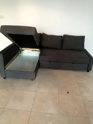Grey fabric L-shaped sofa with storage - good condition