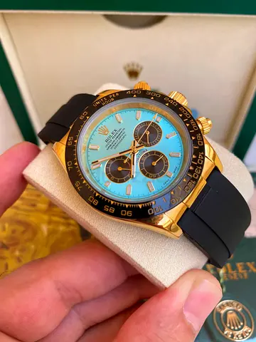 This Rolex Cosmograph Daytona is aLN model featuring a bright turquoise "Tiffany" dial.