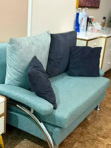 Light teal 3+2+1-seater sofa with dark cushions