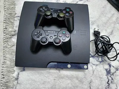 ps3 slim modded with 2 controllers working condition with 4 games