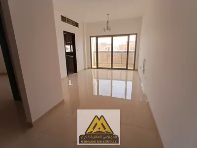 2BR apartment in Al Alia, spacious, 2 bathrooms, balcony, central AC, new family building. AED 40K, 4 payments.