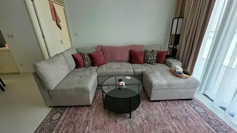 Pull out Sofa Bed. Light grey L-shaped sectional sofa with chaise and cushions - great condition