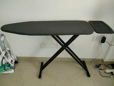 Sturdy foldable ironing board with iron rest - good condition