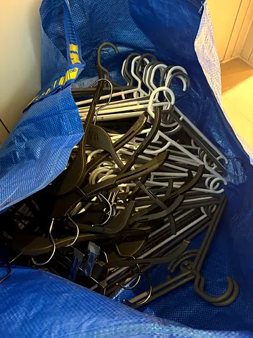 Bundle of 70+ plastic clothes hangers - excellent condition