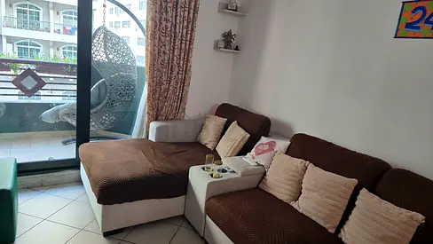 L-shaped brown and beige fabric sofa with chaise - good condition
