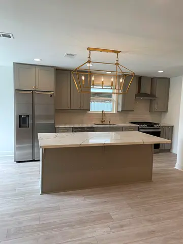 Modern kitchen island with marble top and storage cabinet