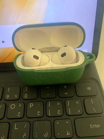 Used Apple AirPods with silicone protective case - working condition