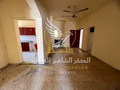 Two-bedroom apartment with a living room in Abu Shagara, annual rent, 2 bathrooms, suitable for sing