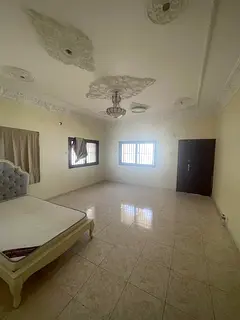 Arabic house for rent in Al Nakhilat: 4 bedrooms, living room, maid’s room, 4 payments, cheque dep